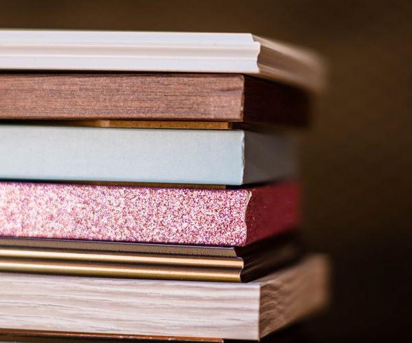 A collection of kettlebells neatly arranged on a gym floor.